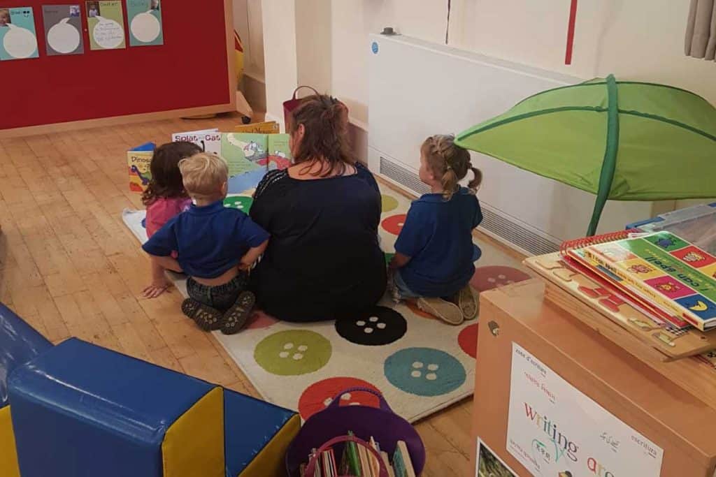 Children and teacher engaged in storytime at Whitley Community Preschool.