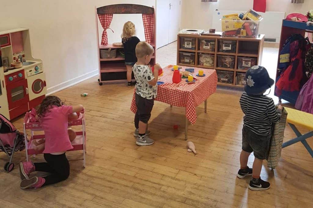 Preschool children playing with toys in a classroom setting at Whitley Community Preschool.
