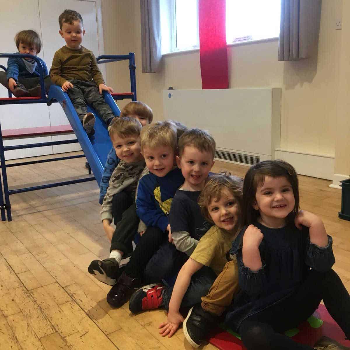 cropped-2018-03-12-PHOTO-00000005.jpg Children enjoying playtime on a slide at Whitley Community Preschool.